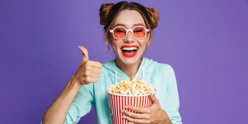 teen eating popcorn