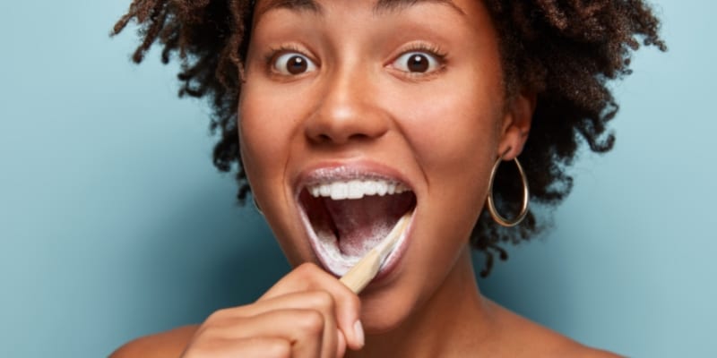 woman brushing teeth